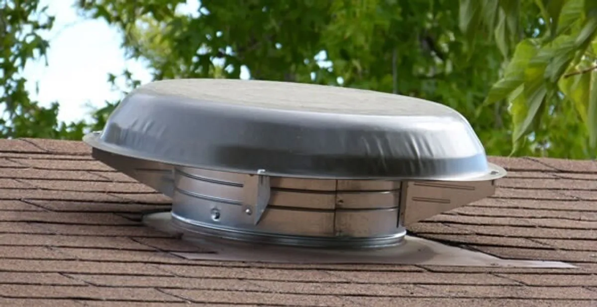 attic fan installation services with low-profile roof ventilation unit in Flagstaff, AZ