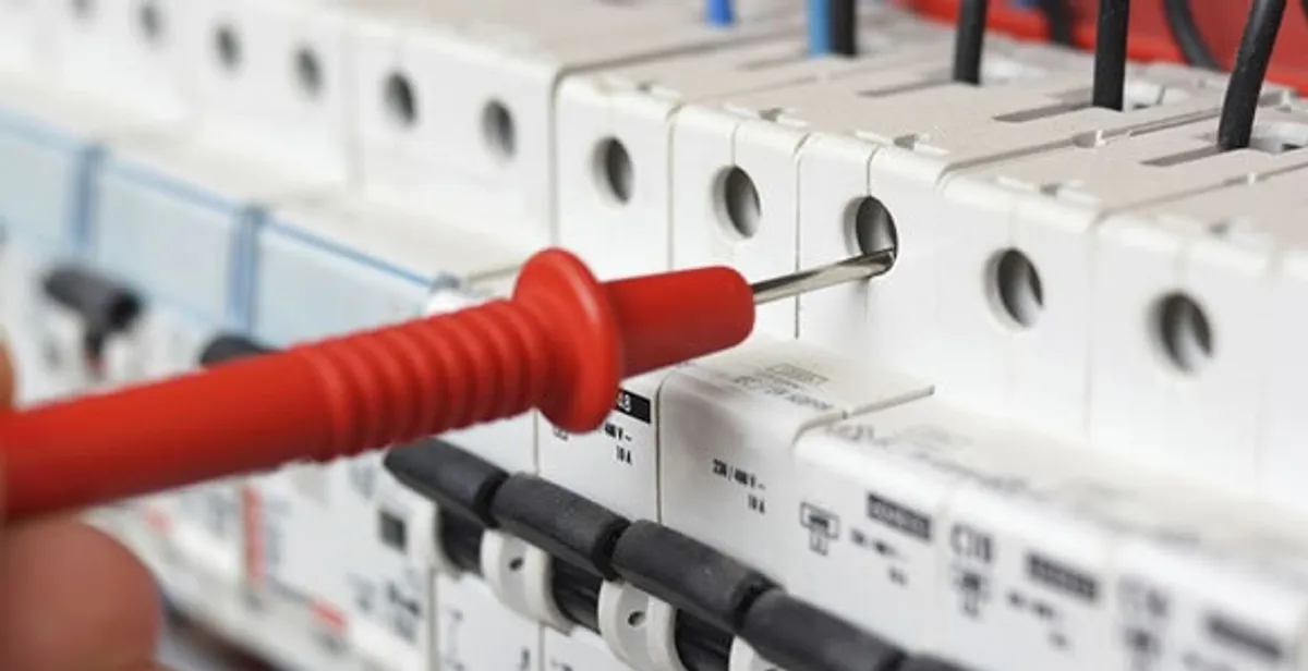 Electrical contractor testing circuit breakers during electrical repair in Rimrock, AZ
