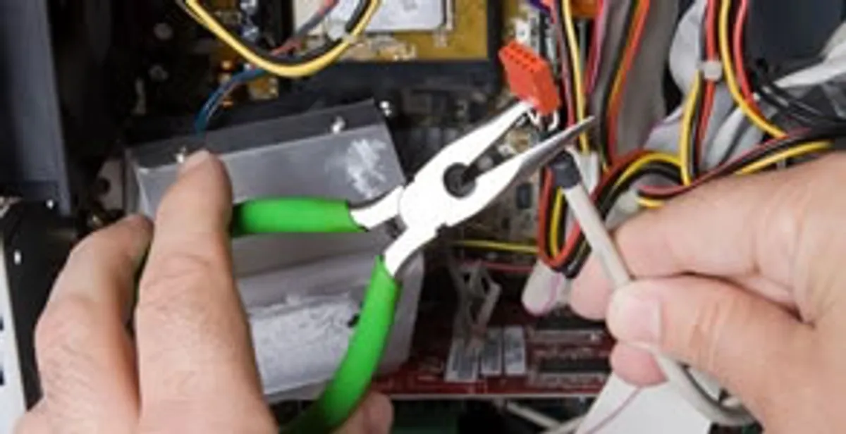 Licensed electrical contractor performing electrical repair with tools in Mormon Lake, AZ