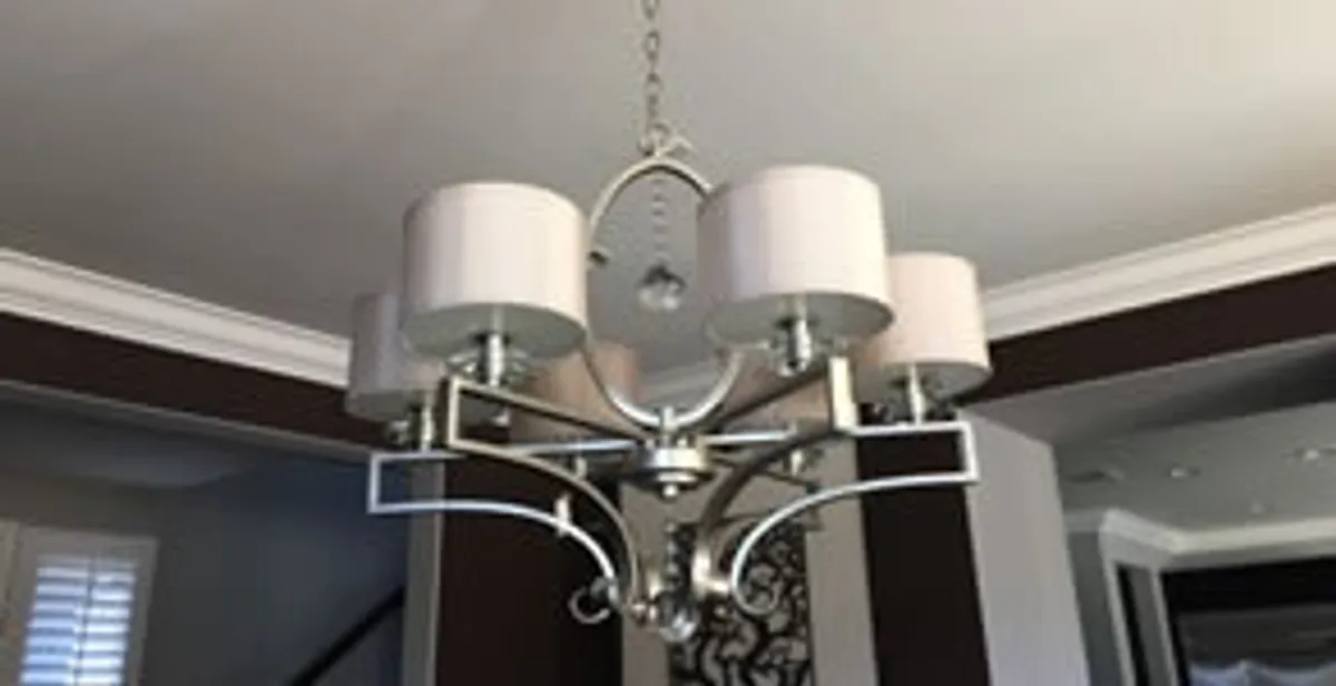 Modern chandelier installation with multiple light fixtures in Flagstaff, AZ